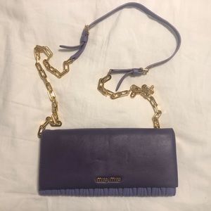 Miu Miu purple & gold crossbody bag.